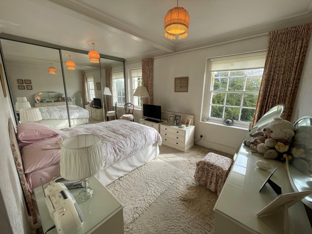 Lot: 41 - TWO-BEDROOM FLAT IN DESIRABLE LOCATION - Bedroom with built in wardrobe and sea views
